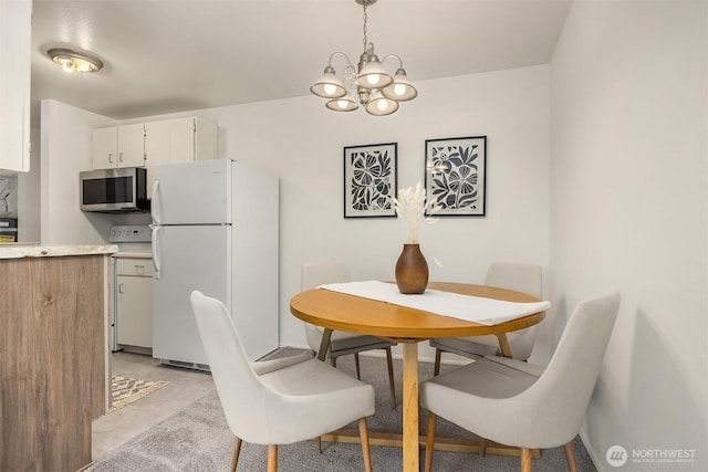 19428 Aurora Ave N Unit 427, Shoreline, WA 98133 - dining area with a chandelier