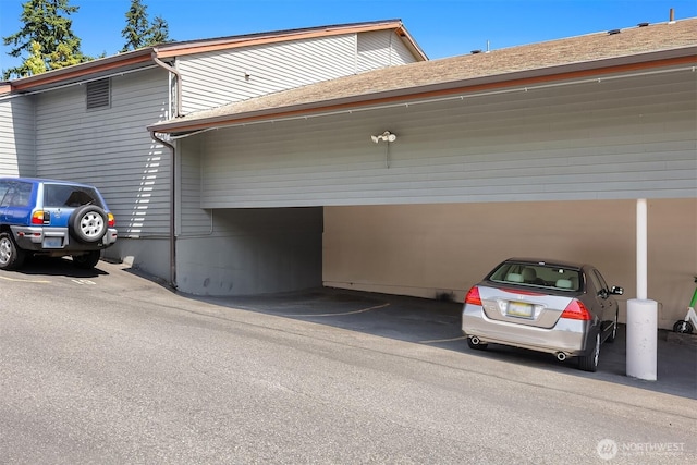 19428 Aurora Ave N Unit 427, Shoreline, WA 98133 - garage featuring covered parking