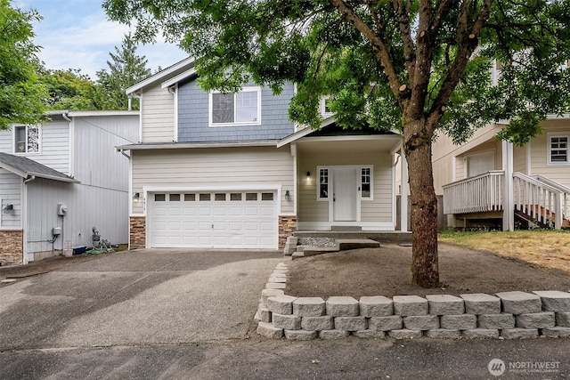 4817 S 251st Ct, Kent, WA 98032 - view of front of house with asphalt driveway, an attached garage, and stone siding