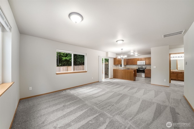 4817 S 251st Ct, Kent, WA 98032 - unfurnished living room with a chandelier and light carpet