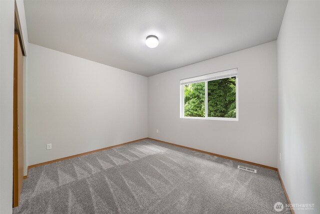 4817 S 251st Ct, Kent, WA 98032 - carpeted empty room with baseboards