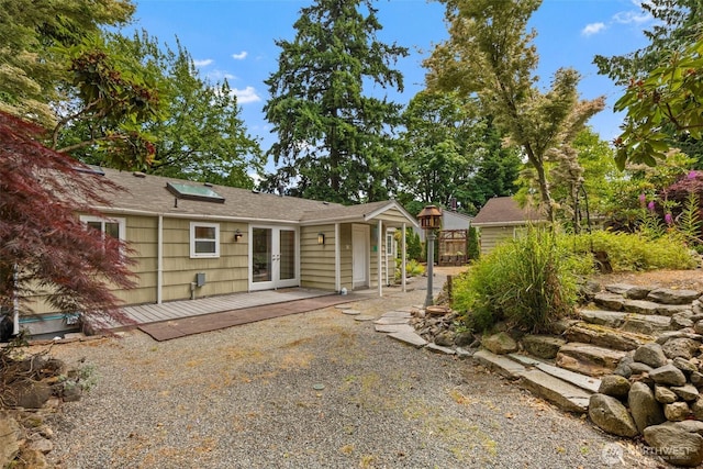 14023 Meridian Ave N, Seattle, WA 98133 - rear view of house featuring french doors, a deck, and a shingled roof