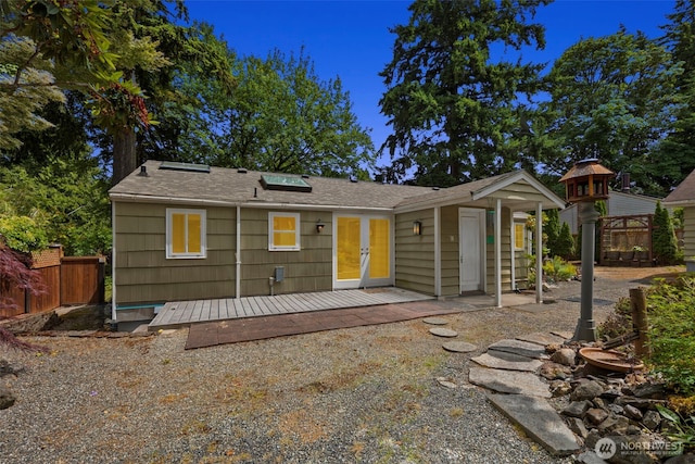 14023 Meridian Ave N, Seattle, WA 98133 - view of front of house with a deck, french doors, and roof with shingles