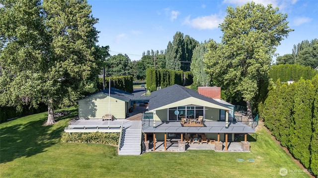 2102 NE Elgin Rd, Moses Lake, WA 98837 - rear view of property featuring a patio area, a deck, stairway, and a lawn