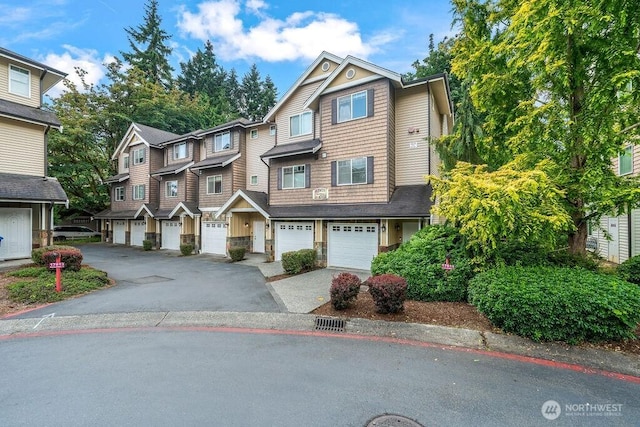 17815 80th Ave NE Unit C-1, Kenmore, WA 98028 - view of front of house featuring driveway, a residential view, an attached garage, and stone siding