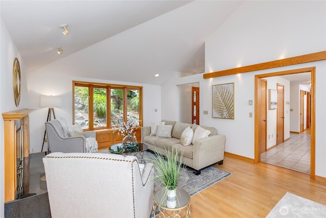 7401 E Heather Way, Everett, WA 98203 - living room featuring wood finished floors and high vaulted ceiling