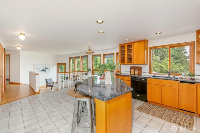 7401 E Heather Way, Everett, WA 98203 - kitchen with black dishwasher, healthy amount of natural light, a kitchen island, recessed lighting, and a kitchen breakfast bar