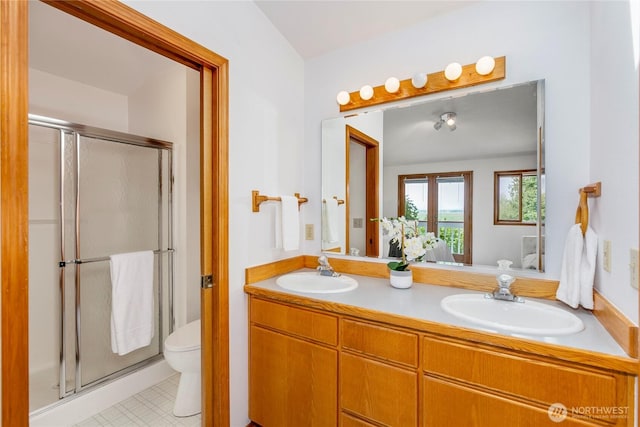 7401 E Heather Way, Everett, WA 98203 - bathroom with a stall shower, double vanity, and tile patterned floors