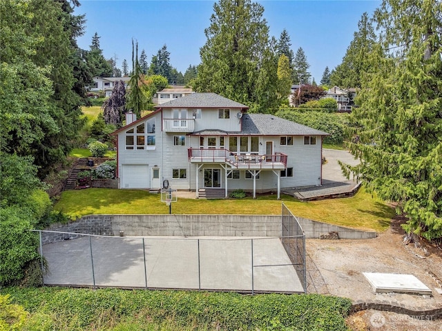 7401 E Heather Way, Everett, WA 98203 - back of property with a deck, a lawn, and an attached garage