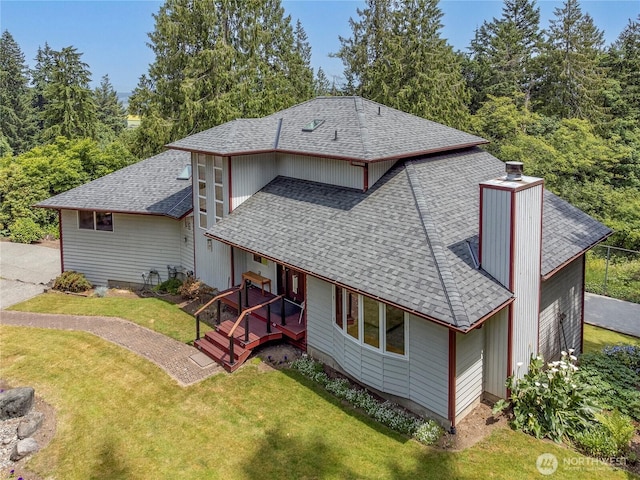 7401 E Heather Way, Everett, WA 98203 - back of house with a shingled roof, a yard, and a chimney