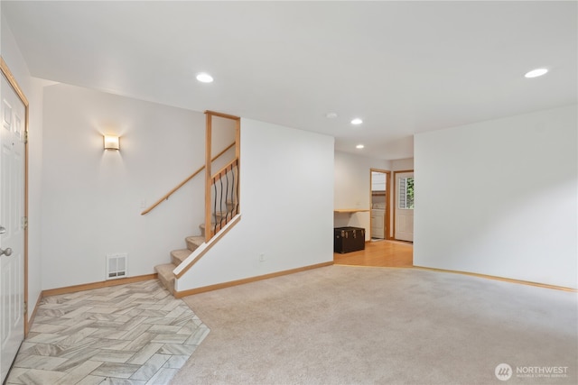 1625 Lincoln St, Bellingham, WA 98229 - unfurnished living room featuring recessed lighting, washer / dryer, stairs, and light carpet