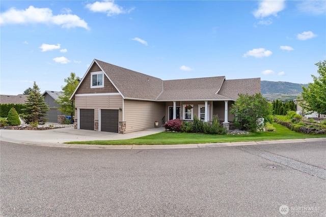 2835 Aspen Shores Dr, East Wenatchee, WA 98802 - view of front of house with driveway, an attached garage, a front lawn, roof with shingles, and covered porch