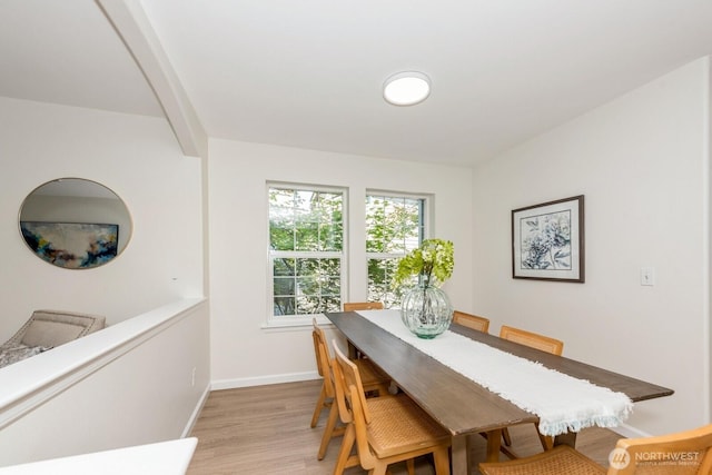 18505 SE Newport Way Unit E221, Issaquah, WA 98027 - dining space featuring light wood-type flooring and baseboards