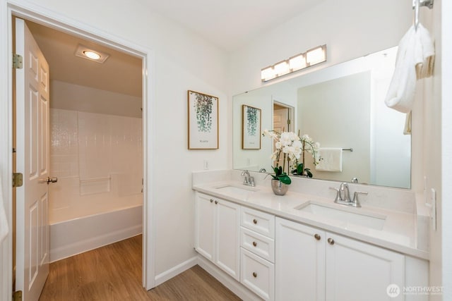 18505 SE Newport Way Unit E221, Issaquah, WA 98027 - bathroom with wood finished floors and double vanity