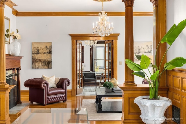 1214 Warren Ave N, Seattle, WA 98109 - living area featuring a chandelier, crown molding, and wood finished floors