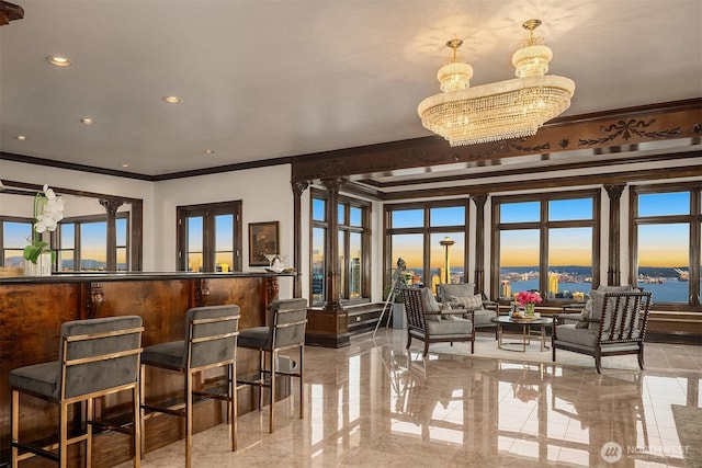 1214 Warren Ave N, Seattle, WA 98109 - dining area featuring ornamental molding, a chandelier, a water view, and recessed lighting