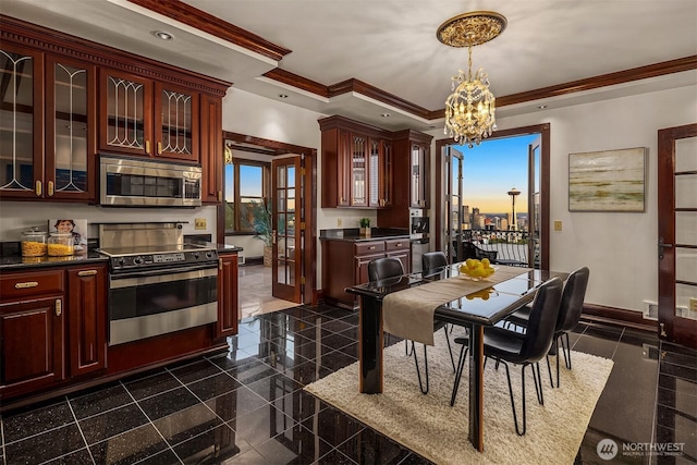 1214 Warren Ave N, Seattle, WA 98109 - dining area with crown molding, granite tiled floors, a chandelier, a tray ceiling, and recessed lighting