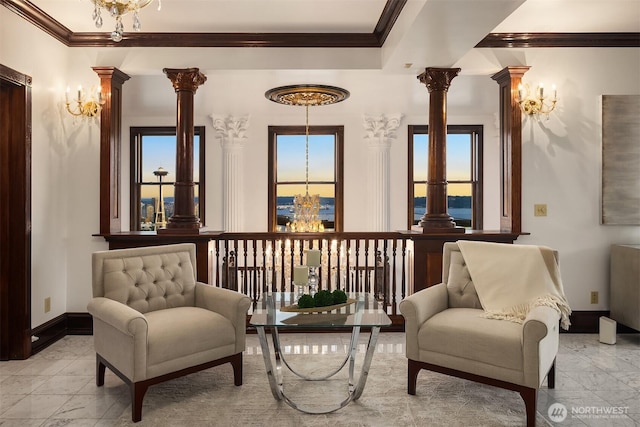 1214 Warren Ave N, Seattle, WA 98109 - living area with a chandelier, decorative columns, ornamental molding, and light marble finish flooring