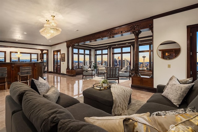 1214 Warren Ave N, Seattle, WA 98109 - living area with ornamental molding, decorative columns, a view of city, and a chandelier