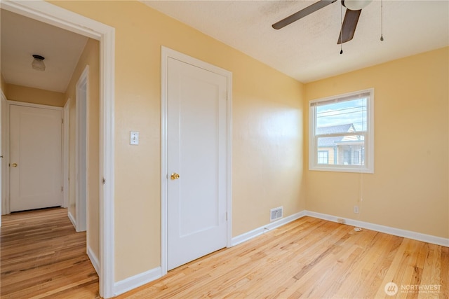 1028 20th Ave, Longview, WA 98632 - unfurnished bedroom featuring wood finished floors and ceiling fan