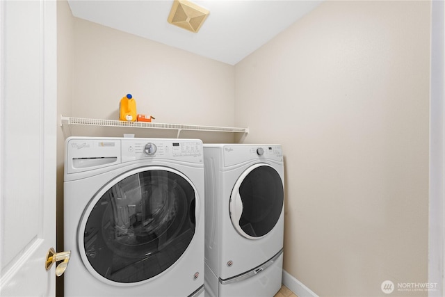 2702 Shannon Point Rd, Anacortes, WA 98221 - laundry room with washing machine and dryer and baseboards