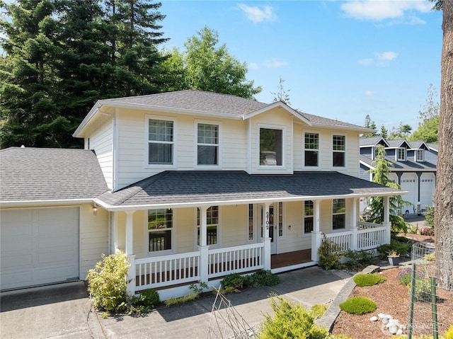 2702 Shannon Point Rd, Anacortes, WA 98221 - view of front of house with a porch, an attached garage, and roof with shingles