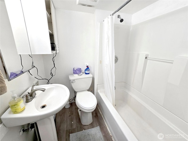 4715 19th Ave NE, Seattle, WA 98105 - full bath featuring wood finished floors and shower / bath combination with curtain