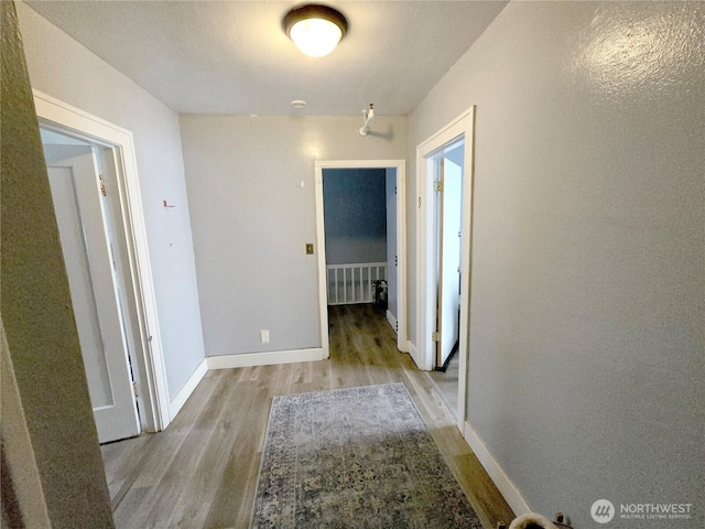 4715 19th Ave NE, Seattle, WA 98105 - hallway featuring light wood-type flooring and baseboards