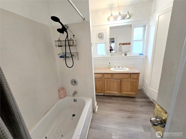 4715 19th Ave NE, Seattle, WA 98105 - bathroom with shower / bathtub combination, wood finished floors, and vanity