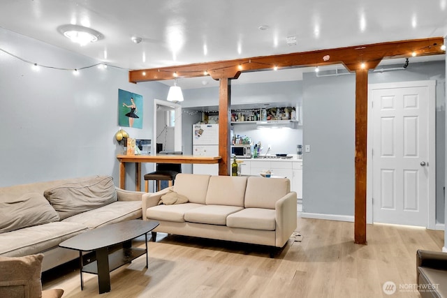 4715 19th Ave NE, Seattle, WA 98105 - living room with light wood-style floors and beamed ceiling
