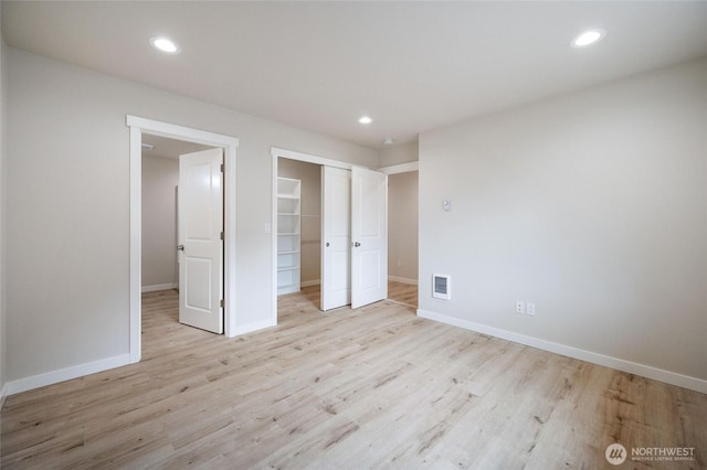 8256 Gold Run Dr, Maple Falls, WA 98266 - unfurnished bedroom featuring wood finished floors, a closet, and recessed lighting