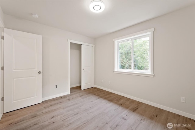 8256 Gold Run Dr, Maple Falls, WA 98266 - unfurnished bedroom with light wood-type flooring and a closet