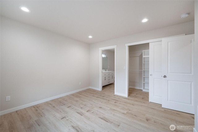 8256 Gold Run Dr, Maple Falls, WA 98266 - unfurnished bedroom featuring light wood finished floors, a closet, recessed lighting, ensuite bath, and a walk in closet