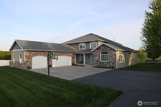 12003 Summit Haven Pl, Yakima, WA 98908 - view of front of property featuring driveway, a garage, stone siding, a front lawn, and a shingled roof