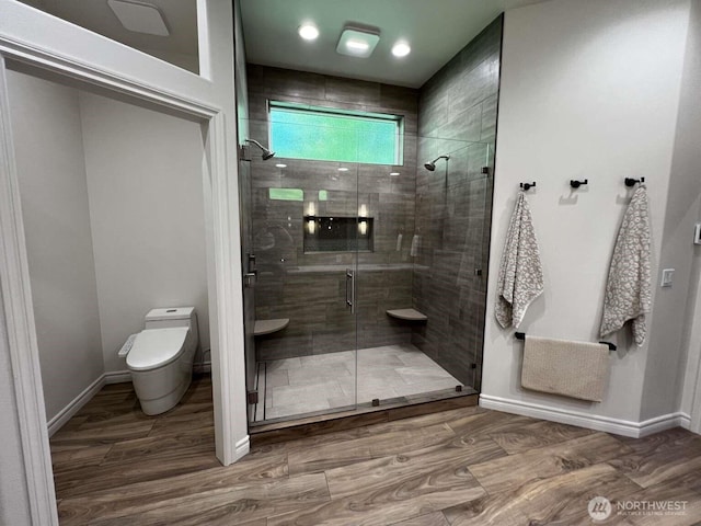 12003 Summit Haven Pl, Yakima, WA 98908 - bathroom featuring a stall shower and wood finished floors