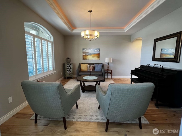 12003 Summit Haven Pl, Yakima, WA 98908 - living room with a tray ceiling, a chandelier, and wood finished floors