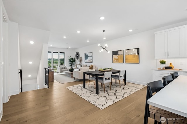 12257 137th Pl NE Unit 2901, Redmond, WA 98052 - dining space with light wood-style flooring, a chandelier, and recessed lighting