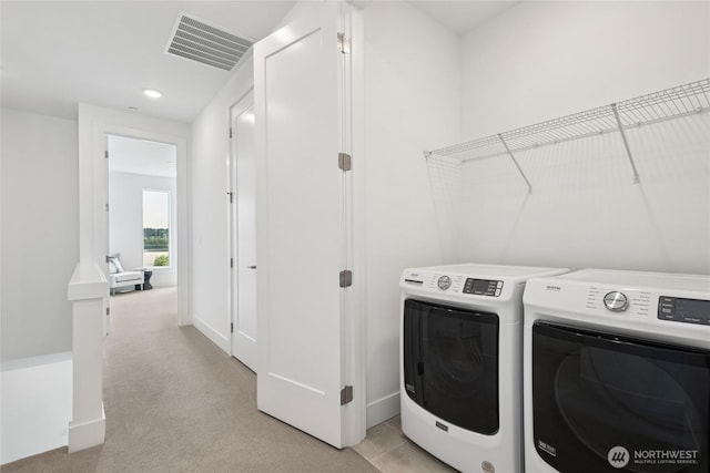 12257 137th Pl NE Unit 2901, Redmond, WA 98052 - laundry room featuring washing machine and clothes dryer, light colored carpet, and recessed lighting