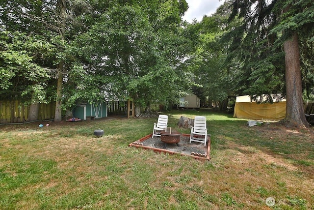 1271 Rickover Dr, Coupeville, WA 98239 - view of yard featuring a shed and an outdoor fire pit