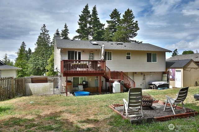 1271 Rickover Dr, Coupeville, WA 98239 - back of house featuring stairs, a fire pit, a deck, a chimney, and a shed
