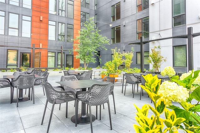 1085 103rd Ave NE Unit 217, Bellevue, WA 98004 - view of patio with outdoor dining area