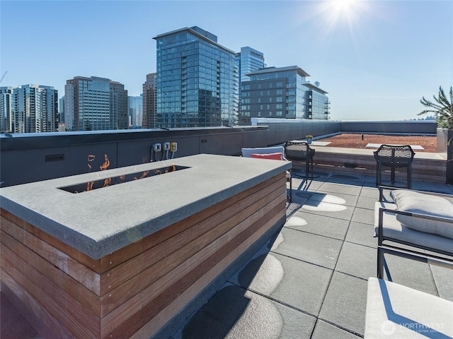 1085 103rd Ave NE Unit 217, Bellevue, WA 98004 - view of patio / terrace with a view of city