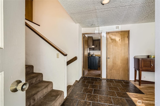 2708 NE 106th Pl, Seattle, WA 98125 - foyer entrance with stairs, stone tile flooring, and a textured ceiling
