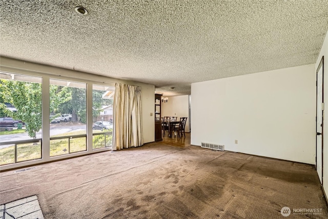 2708 NE 106th Pl, Seattle, WA 98125 - unfurnished living room featuring carpet floors and a textured ceiling