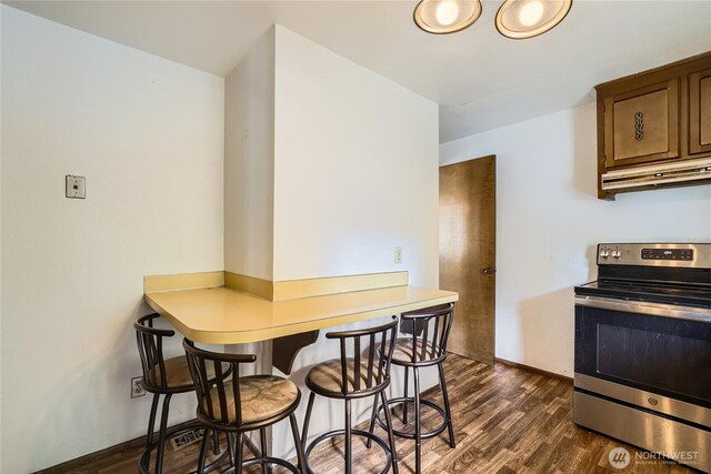 2708 NE 106th Pl, Seattle, WA 98125 - dining space with dark wood-type flooring and baseboards