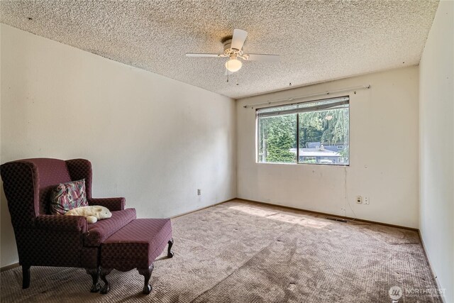 2708 NE 106th Pl, Seattle, WA 98125 - sitting room featuring carpet, a ceiling fan, and a textured ceiling