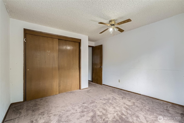 2708 NE 106th Pl, Seattle, WA 98125 - unfurnished bedroom with carpet, a closet, a textured ceiling, and a ceiling fan