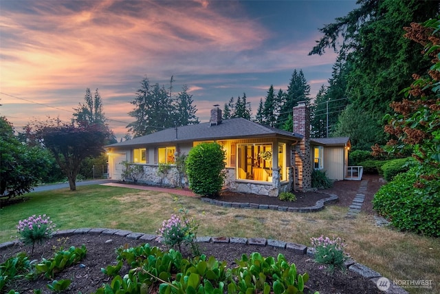 852 NE 194th St, Shoreline, WA 98155 - view of front of house with a chimney, a front yard, stone siding, and an attached garage