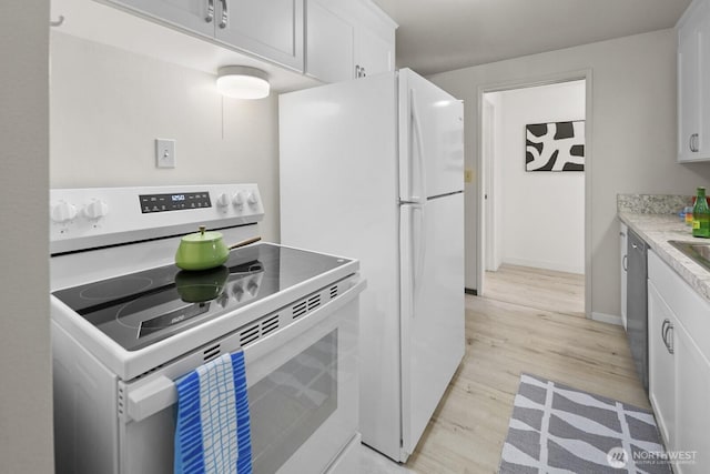 852 NE 194th St, Shoreline, WA 98155 - kitchen featuring white appliances, light wood-style floors, white cabinetry, and light countertops
