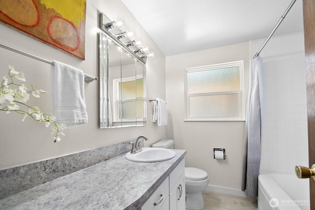 852 NE 194th St, Shoreline, WA 98155 - bathroom with vanity, shower / bathtub combination with curtain, and wood finished floors